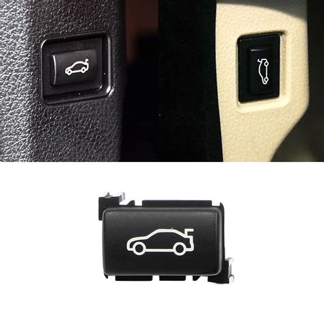 simbolis bagažinės atidarymo mygtukas ant automobilio rakto