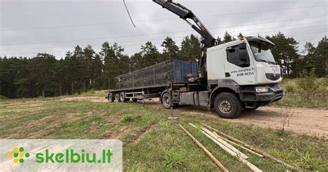 Nuotrauka su priekaba ir prikabintu balastiniu svoriu