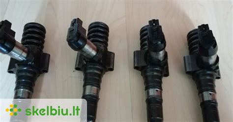 Nuotrauka su patikrintais Common Rail purkštukais ant stendo