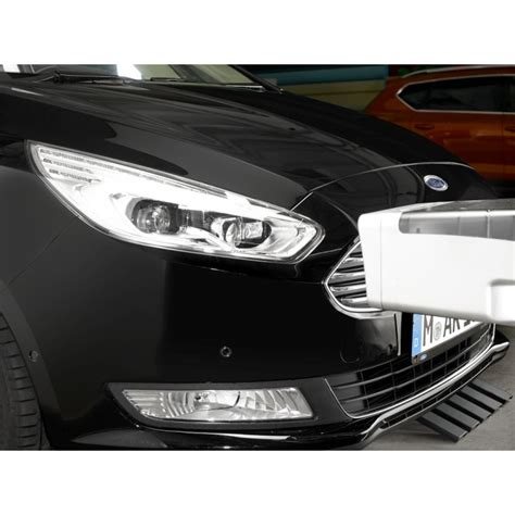 Schematinis priekinių žibintų reguliavimo principas