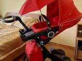 Stokke sportinis vežimėlis su kūdikiu