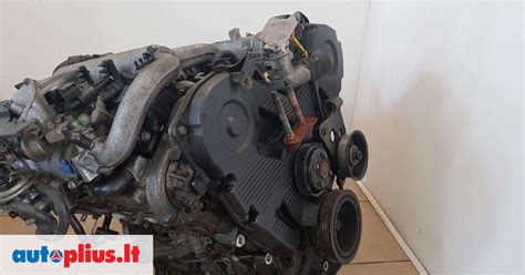 Schematinis Mazda Xedos 9 variklio išdėstymas su detonacijos jutiklio vieta