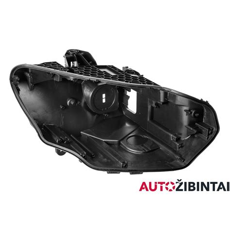 automobilio priekinio žibinto mechanizmas