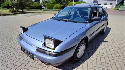 Mazda 323F priekiniai žibintai
