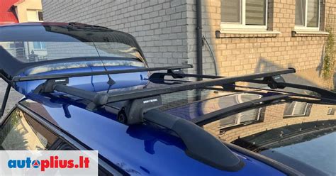 Nuotrauka Subaru Outback su stogo skersiniais