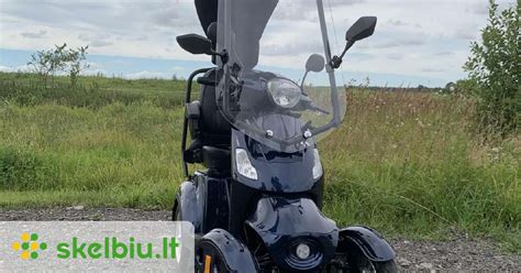 elektrinis motoroleris su stogu