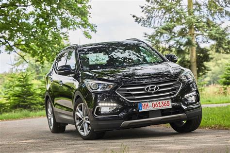 Nuotrauka: Hyundai Santa Fe III salono su sumontuotais guminiais kilimėliais
