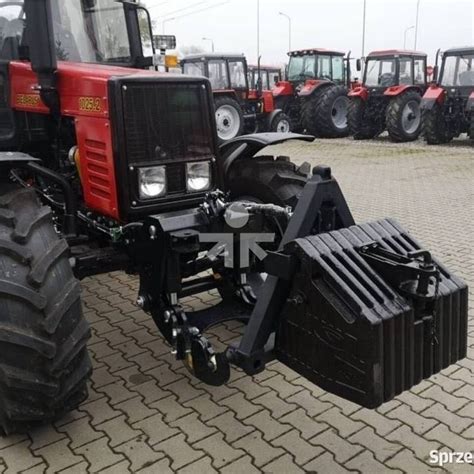 MTZ traktoriaus priekinė ašis su sumontuotu hidrauliniu cilindru