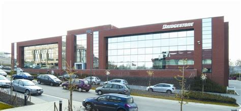 Bridgestone logotipas ir gamykla