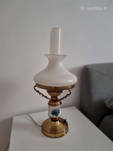 Simbolis: senovinė alyvos lempa su lašu