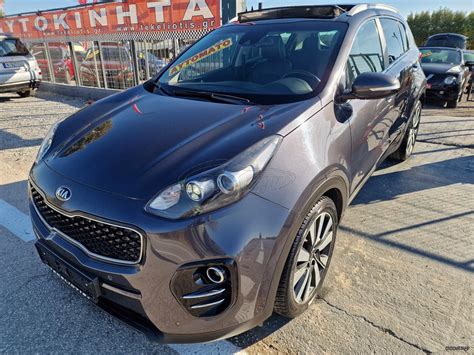 Kia Sportage priekinis vaizdas su vėjo deflektoriais