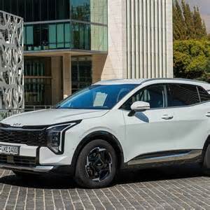 Kia Sportage šoninis vaizdas su vėjo deflektoriais