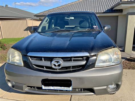 Skirtingi galinių spoileriu tipai Mazda Tribute